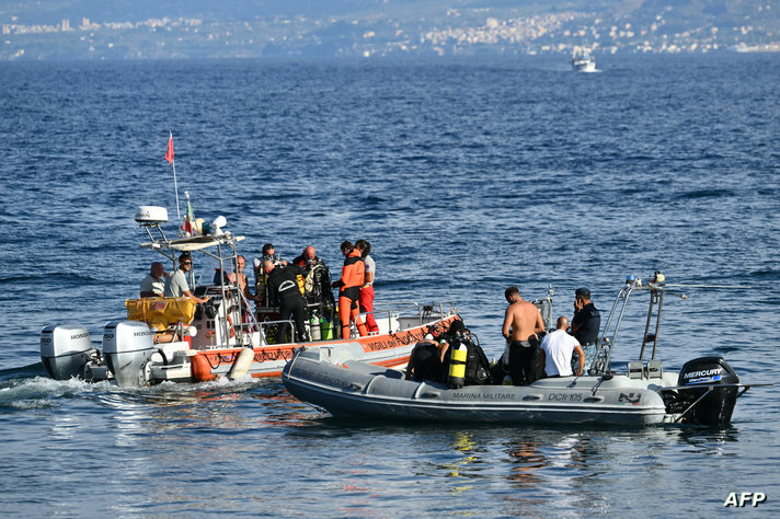 Rescue teams operate off Porticello harbor near Palermo,  where they search for a last missing person on August 22, 2024, three…