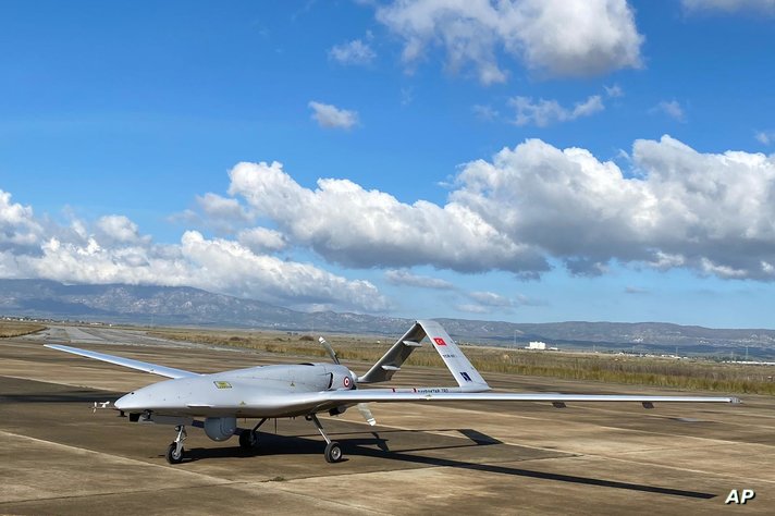 A Turkish-made Bayraktar TB2 drone is seen shortly after its landing at an airport in Gecitkala, known as Lefkoniko in Greek,…