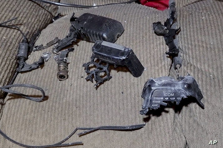 This video grab shows a walkie-talkie that was exploded inside a house, in Baalbek, east Lebanon, Wednesday, Sept. 18, 2024. …